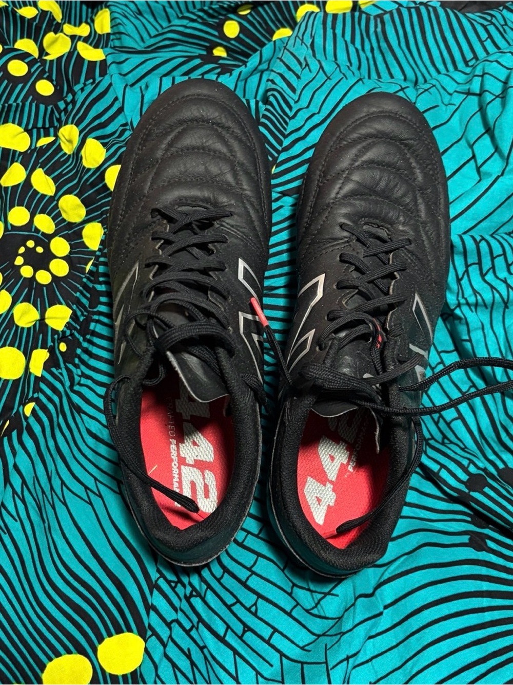 New Balance Black Athletic Lace-Up Soccer Shoes with Red Inners